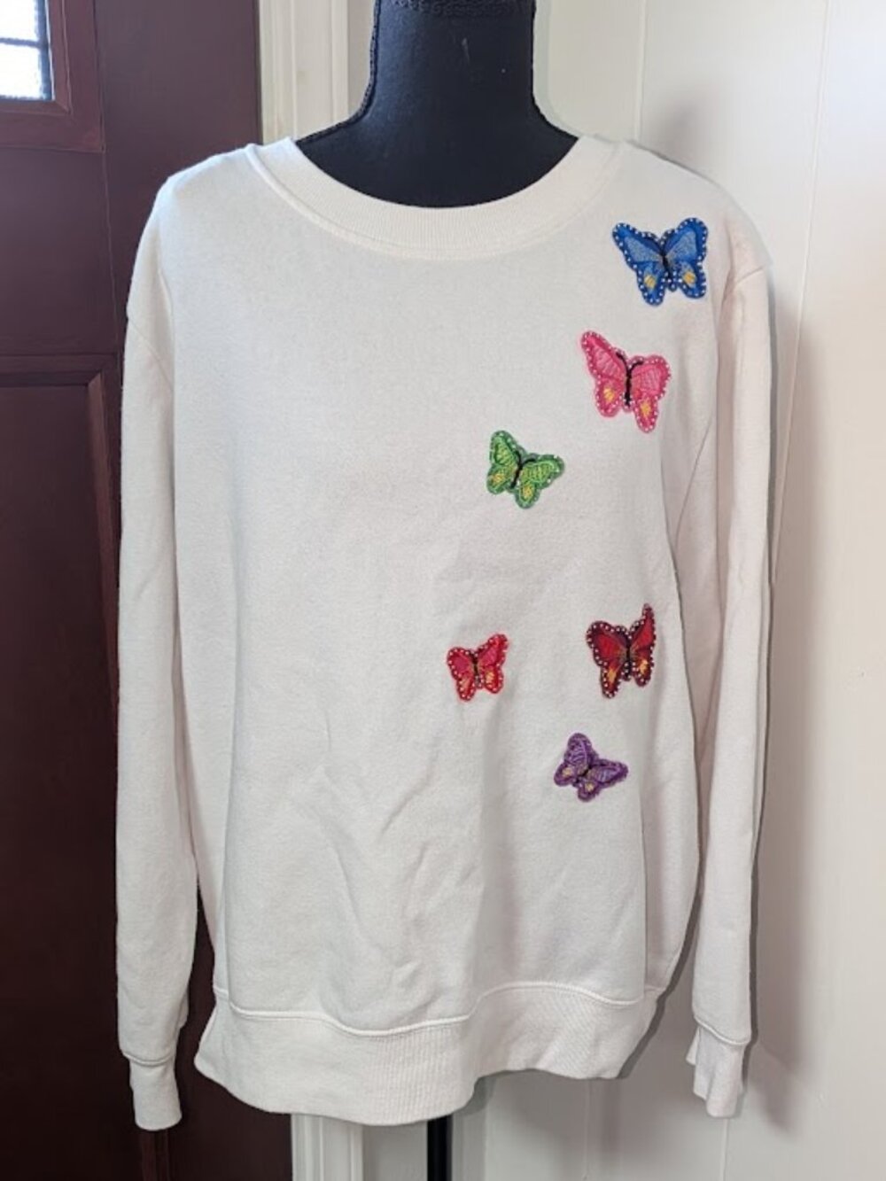 "The Sweatshirt Project" White Crew Neck with colorful butterflies. Size Large
